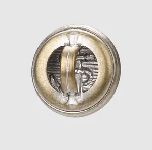 Detail view of high-end vintage brass anchor button with silver and gold finish