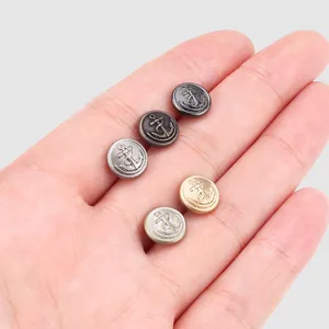 Set of vintage brass anchor buttons for high-end shirts and coats with metallic finish