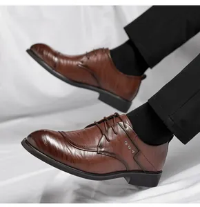 Detailed side view of brown men's dress shoes showing hand-grabbed leather texture.