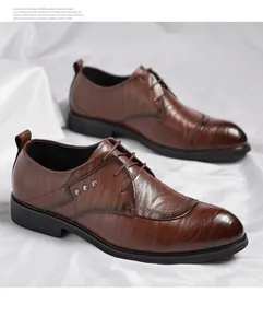 Close-up detail of men's brown business dress shoes with hand-grip textured leather finish.