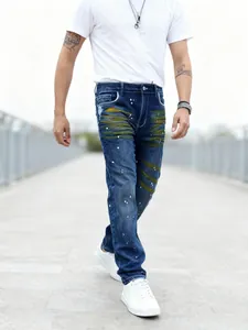 Men's blue straight-leg jeans with unique paint splatter and yellow stripe detail