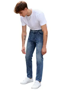 Stylish men's straight-leg blue jeans with vibrant colorful paint splatter design