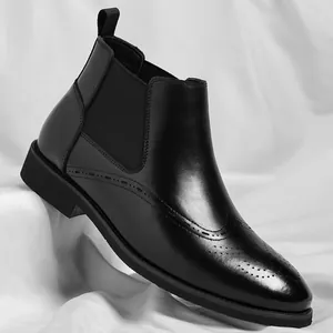Classic black leather men's Chelsea boots featuring elegant brogue wingtip detailing