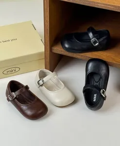 Retro style girls Mary Jane leather shoes displayed in brown, cream, and black colors