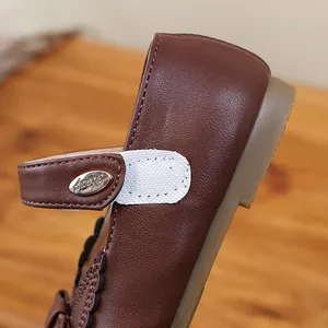 Close-up of brown leather Mary Jane princess shoe for girls with a Velcro strap