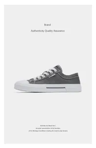 Side view detail of a grey retro casual canvas sneaker with white sole and classic lace-up style