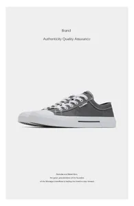 Detailed side view of grey vintage casual canvas sneakers with white laces and soles