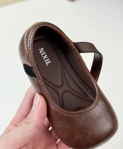 Detailed view of vintage brown leather Mary Jane shoe for girls showing NIXIL brand