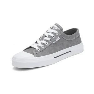 Retro grey canvas sneakers for men featuring a white lace-up design and durable flat soles
