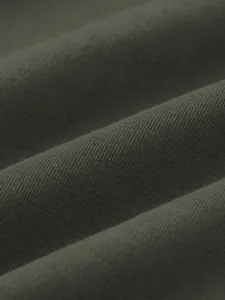 Macro view of dark olive green high-density knit fabric texture for men's sweatshirt