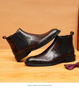 Vintage brown leather Chelsea boots for men with script engraving detail