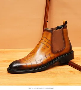 Classic vintage brown leather Chelsea boots for men with decorative etched script