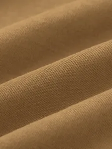 Close-up macro detail of soft brown knit fabric texture for men's hooded sweatshirt