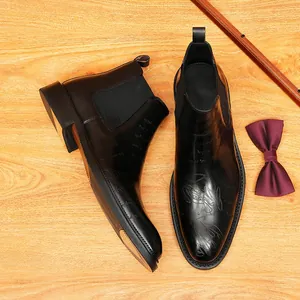 Elegant black leather Chelsea boots with vintage engraved patterns for men