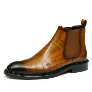 Men's vintage burnished leather Chelsea boots with elegant scripted calligraphy pattern