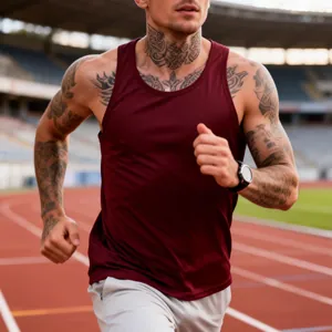 Detail of a men's maroon quick-dry slim fit gym tank top on a running athlete.