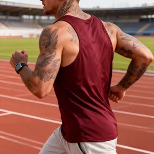 Close-up of maroon quick-dry racerback gym tank top on runner at stadium track.