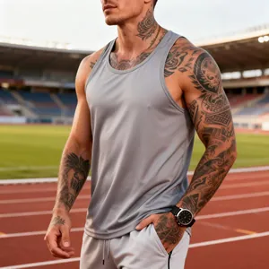 Close-up detail of grey men's quick-dry athletic tank top shown at an outdoor stadium track