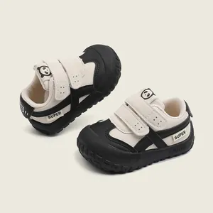 Panda themed black and white toddler walking shoes with soft soles and velcro straps