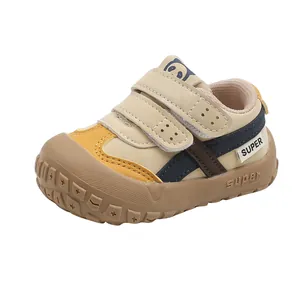 Toddler walking shoes with soft soles and double velcro straps in beige and yellow