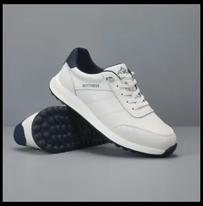 Detail view of men's white leather sneakers showing the anti-slip sole and side design.