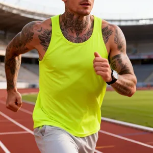 Athletic man running in a neon green slim-fit quick-dry sports tank top on a track