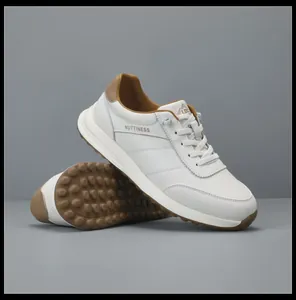 Detailed view of white genuine leather sneakers with thick sole and anti-slip tread