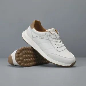 Premium white genuine leather sneakers for men featuring brown accents and textured sole