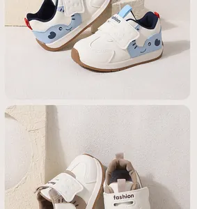Close-up detail of white cartoon baby walking shoes featuring secure magic tape closure