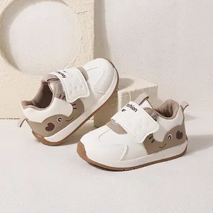 Comfortable cartoon baby walking shoes with soft soles and velcro straps for toddlers
