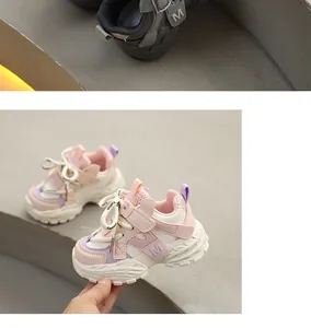 Detail of pink and purple children's chunky sneakers with leather upper and textured sole.