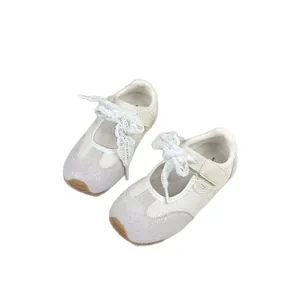 Elegant white children's Mary Jane style sports sneakers with lace bow and flexible soft sole