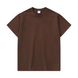 Detail of oversized men's heavy cotton t-shirt in brown, showing high-quality fabric texture.