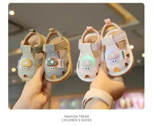 Two pairs of cute cartoon mushroom light-up toddler sandals in pink and green colors