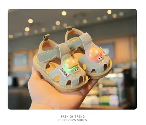 Macro view showing the glowing LED mushroom decoration on soft-sole toddler sandals