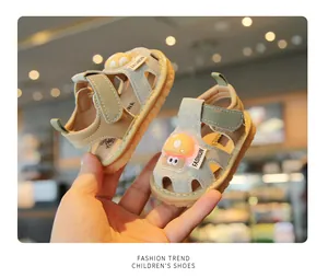 Close-up of toddler light-up sandals featuring a soft sole and cute cartoon mushroom design