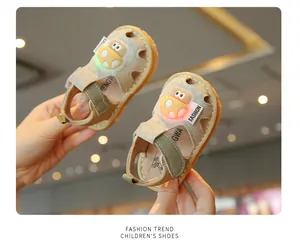 Close-up view of light-up feature on cartoon toddler sandals with soft soles for baby