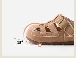 Detail of children's tan suede sandals showing 15-degree anti-collision toe design