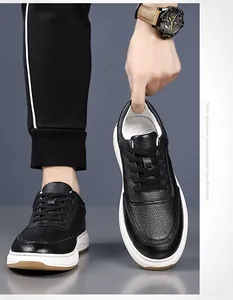 Macro view of premium black pebbled leather texture on stylish men's casual sneakers