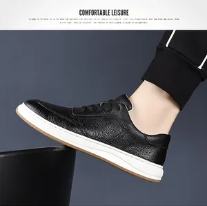 Detail view of men's black cowhide leather sneaker with white sole for casual style