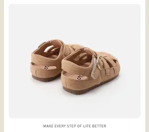 Detailed rear view of tan children's suede Roman sandals featuring hollow out design