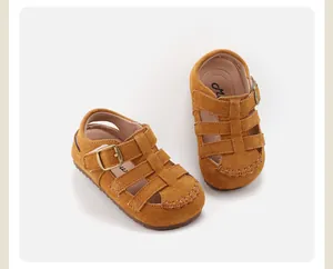 Close-up detail of retro brown suede children's Roman sandals featuring soft soles