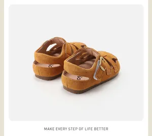 Detailed rear view of brown suede children's Roman sandals with soft non-slip soles.