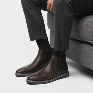 Classic men's retro brown Chelsea boots with distressed leather and slip-on design.