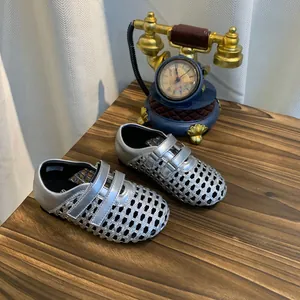Silver woven hollow-out Mary Jane shoes featuring breathable mesh and Velcro strap