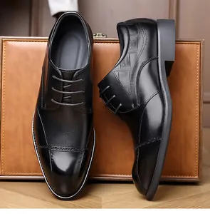 Classic black leather derby shoes with elegant brogue stitching and side profile view