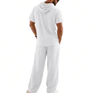 Rear view of mens white linen hooded short sleeve shirt and loose beach pants set