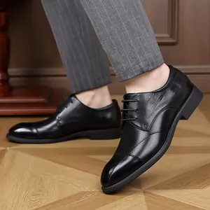 Classic black men's business leather dress shoes with brogue details and laces