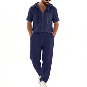 Full model view showing the fit and texture of the navy blue linen hooded shirt and pants