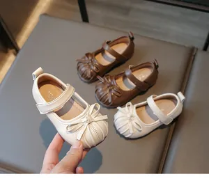 Elegant white girls Mary Jane dress shoes with bow decoration and hook-and-loop strap